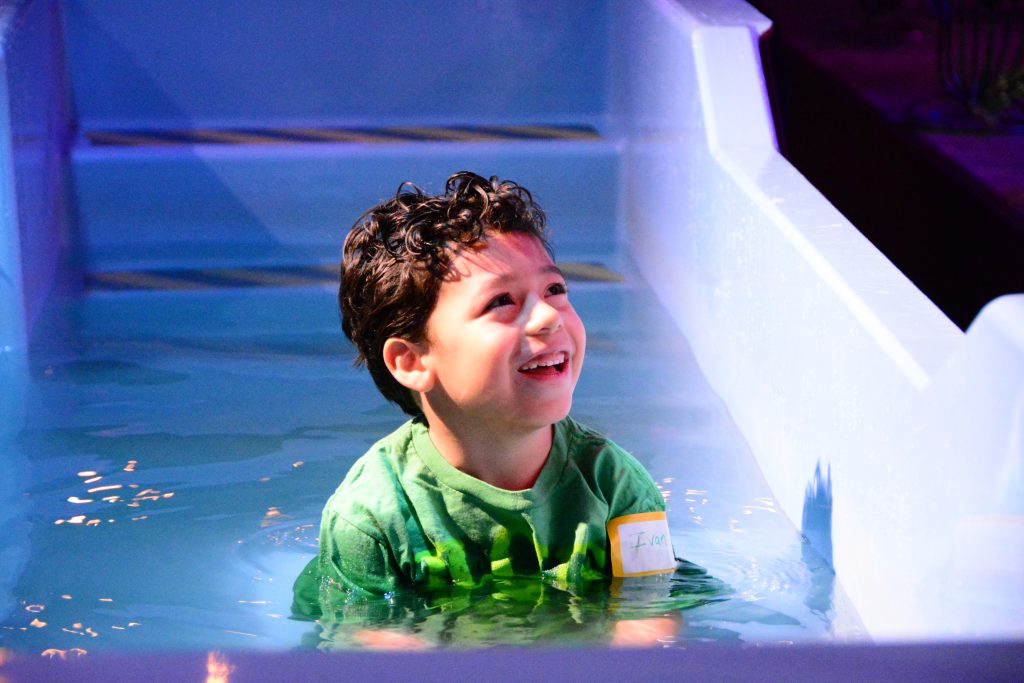 Boy getting baptized at Grace Point Church in Las Vegas Nevada